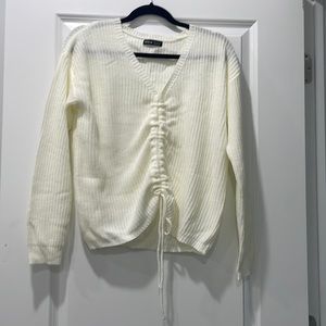Off white sweater with adjustable tie in front